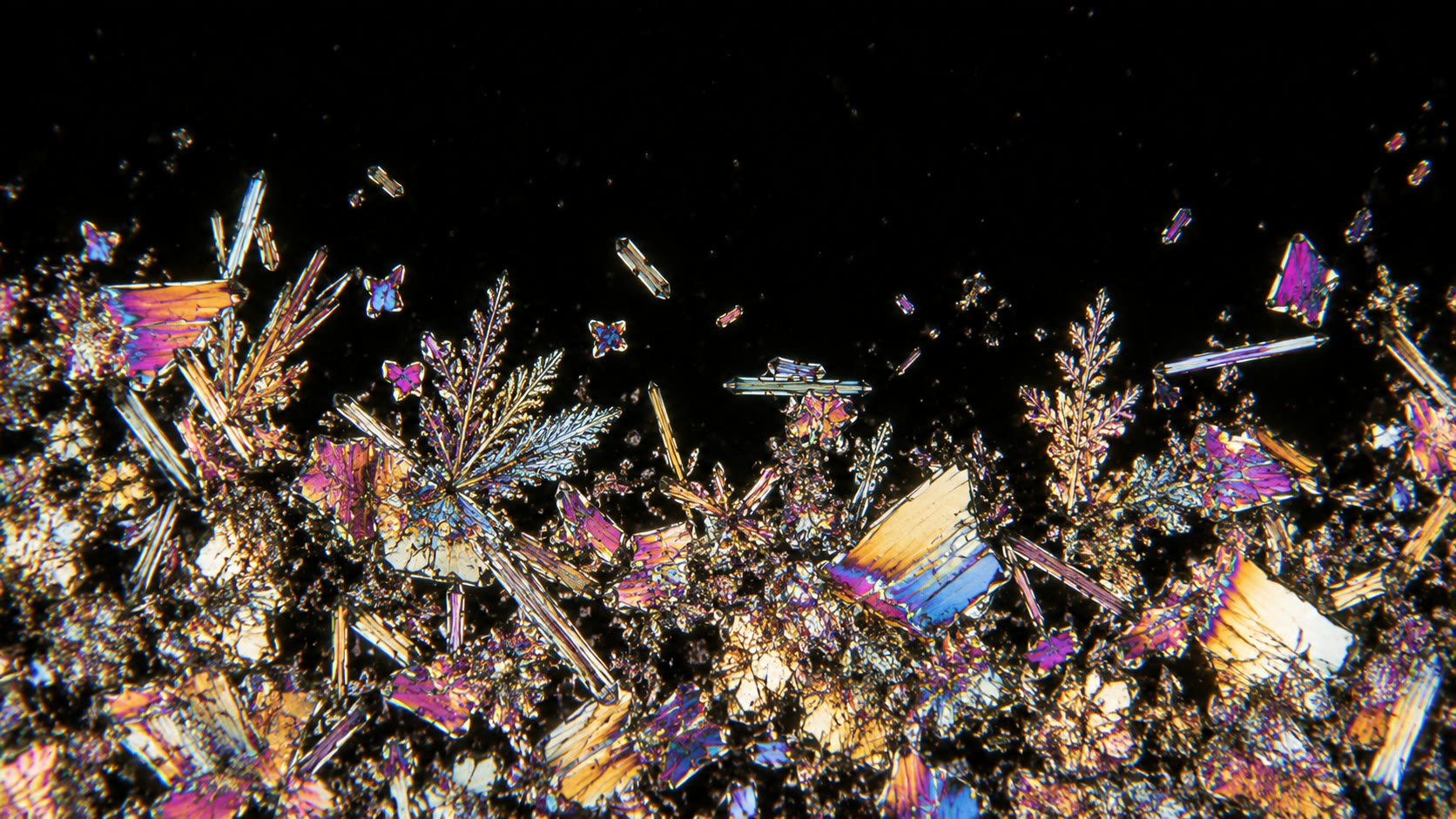 Crystals grown on the ground: mixed sizes, clumped, piled toward the bottom.